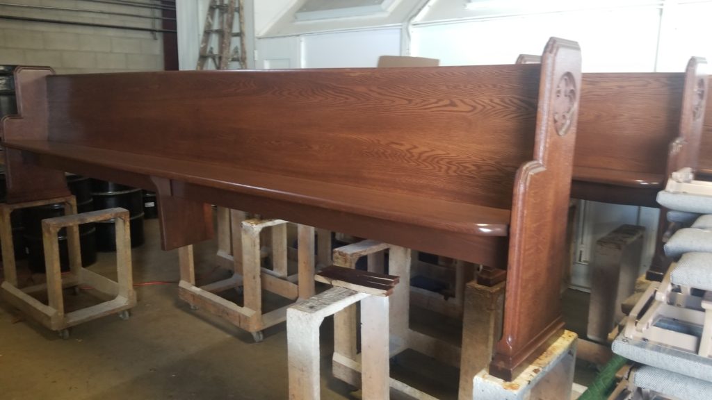 completed project of refinishing pews at sage chapel