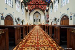 Dark wooden pews in St. Agnes Cathedral church