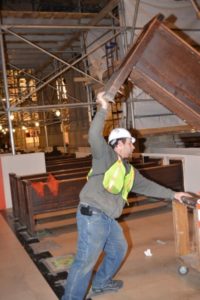 Installing church pews in St. Patrick's Cathedral to preserve history