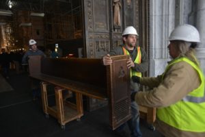 Taking restored church pews into St. Patrick's Cathedral to preserve history