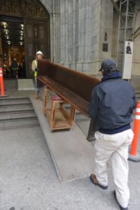 Carrying church pews inside St. Patrick's Cathedral to preserve history
