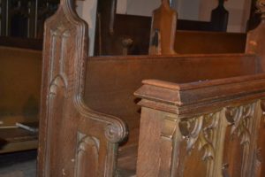 Close up of wooden church pews before getting refinished