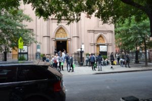 Groups of people outside of a church