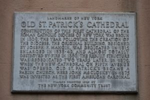 Cement wall plaque outside St. Patrick's Cathedral