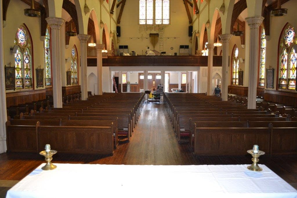 Finished pew installation in a church from behind the alter