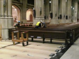 Workers removing church pews from St. Patrick's Cathedral