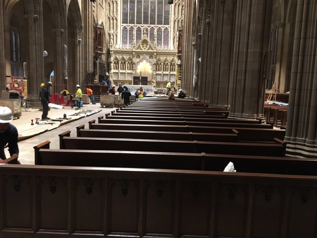 New Church pews being installed by workers Trinity Church