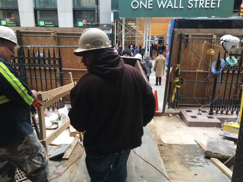 Restored pew benches being loaded into the church to preserve church bench history